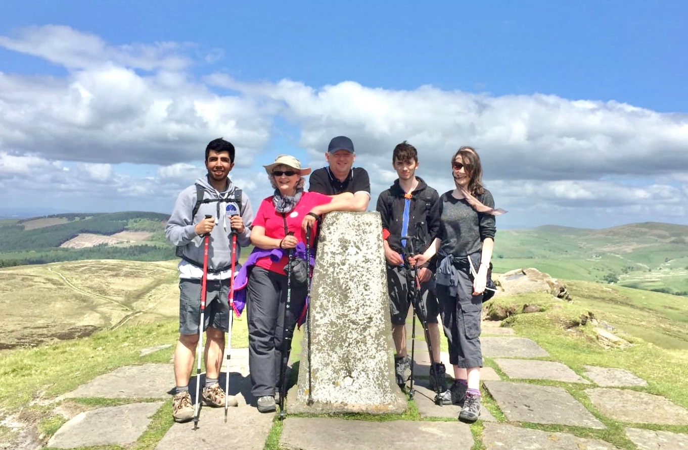 People stood at the peak of Shutlingsloe