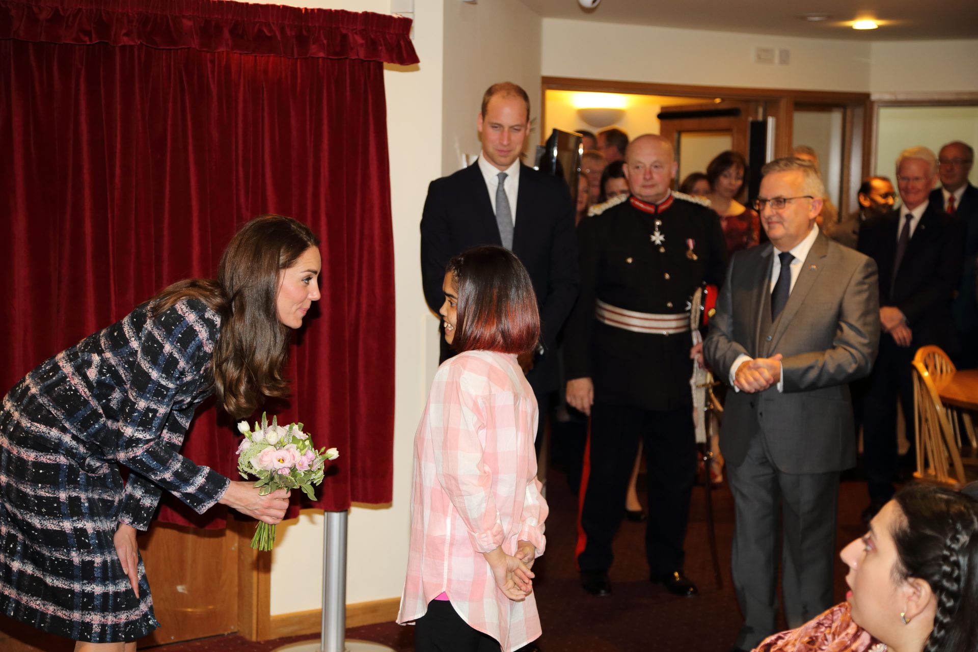 Duchess of Cambridge with little girl at Francis House