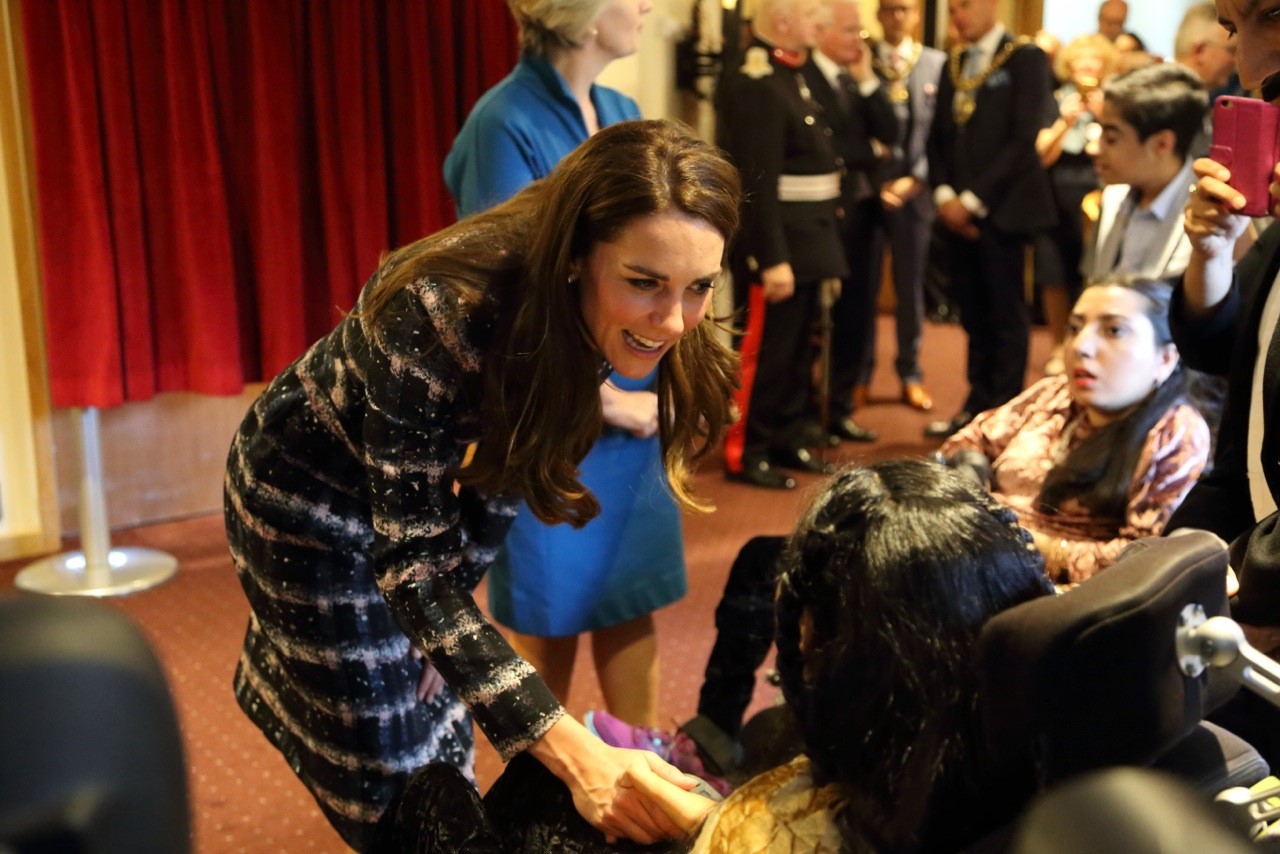 Duchess of Cambridge meets young children at Francis House