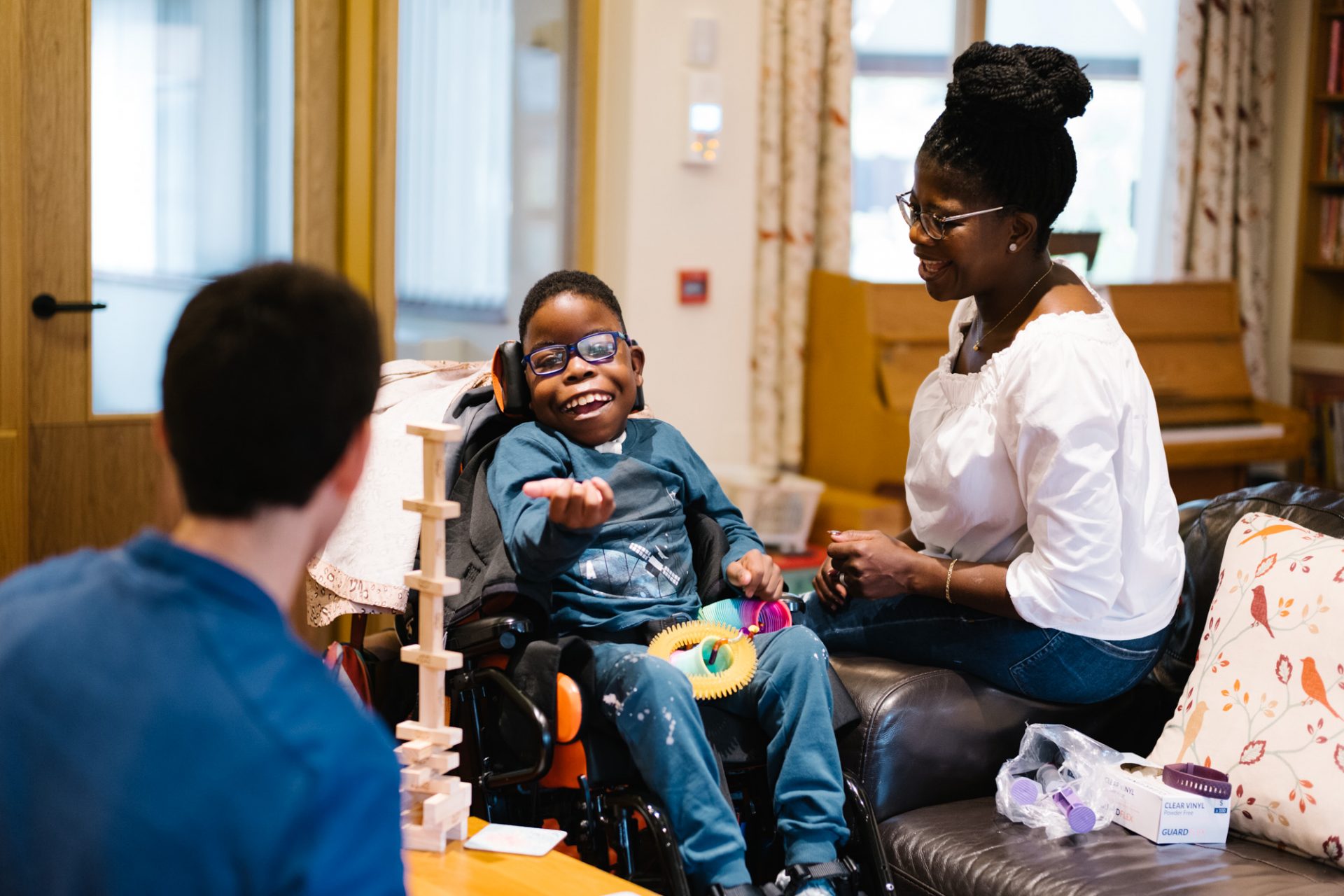 Thabani and Busi in the lounge on respite care