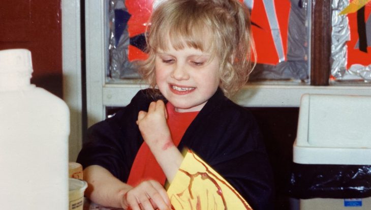 Kerry as a child doing crafts