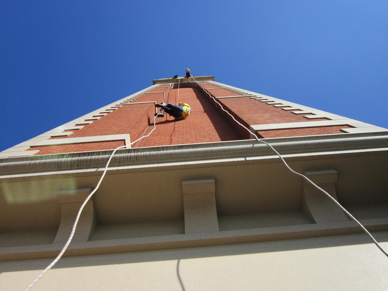 The view from directly below an abseiler on the Trafford Palazzo tower