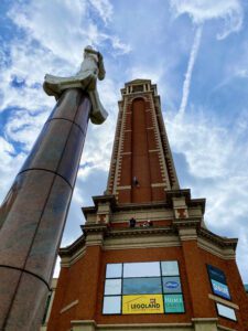 A view of the Trafford Palazzo tower from the base, with a marble tower standing beside it
