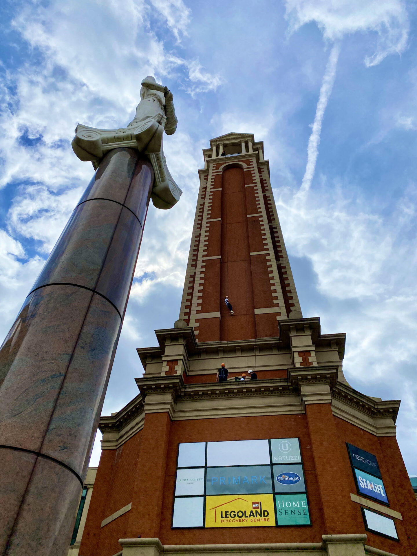 A view of the Trafford Palazzo tower from the base, with a marble tower standing beside it