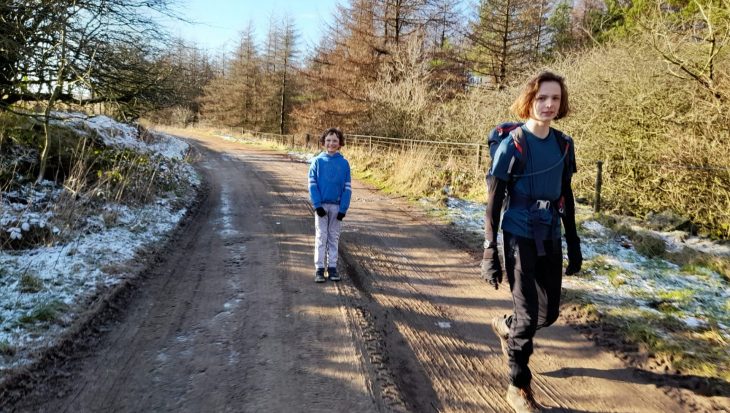 Two boys walking in the countryside