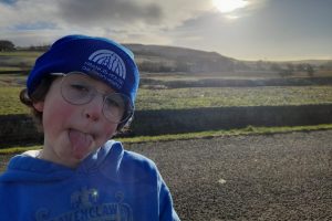 Boy in stood in the outdoors