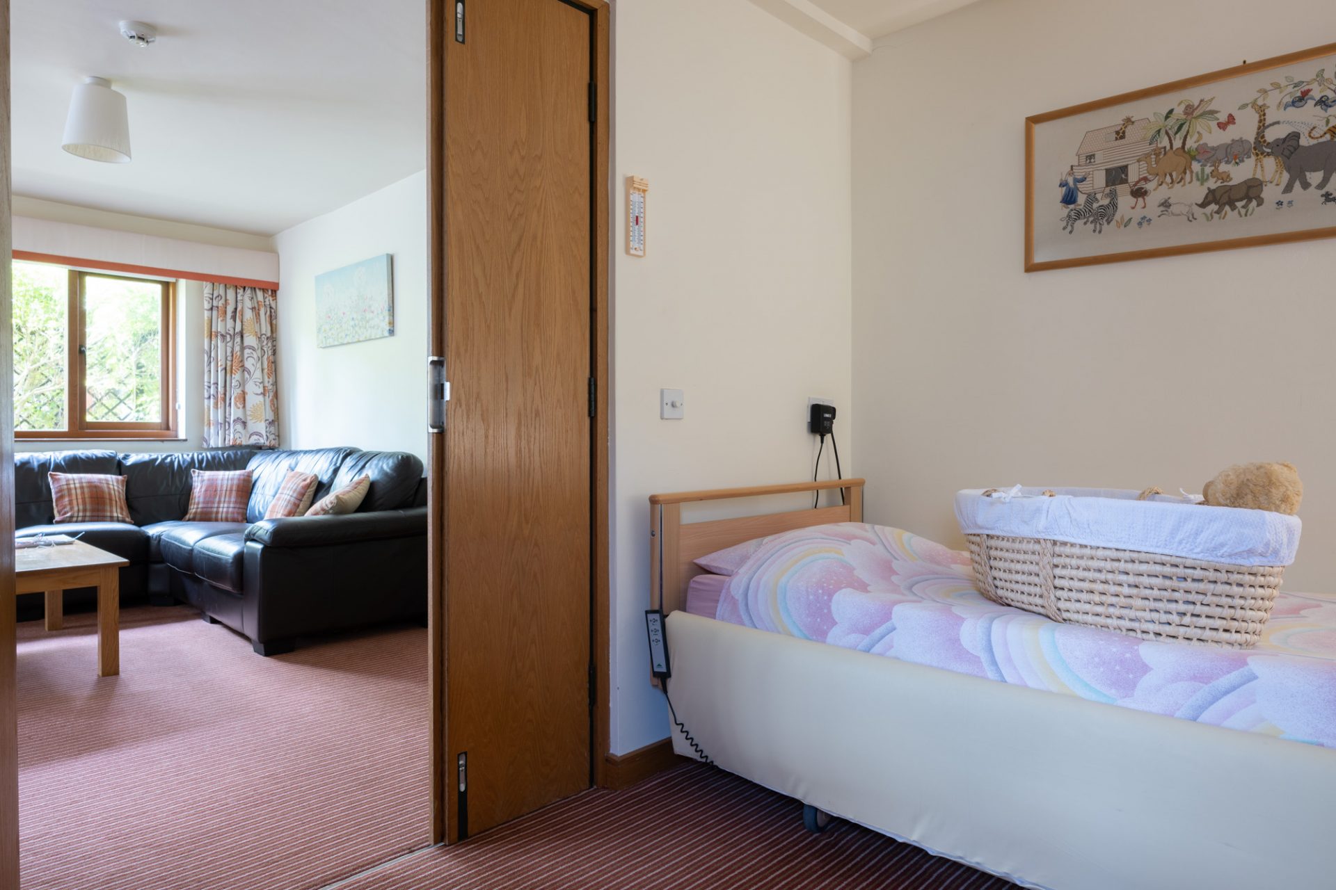 Rainbow room with bed and moses basket