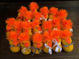 Knitted chicks with fluffy orange hair