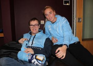 Young person with Manchester City player at Francis House