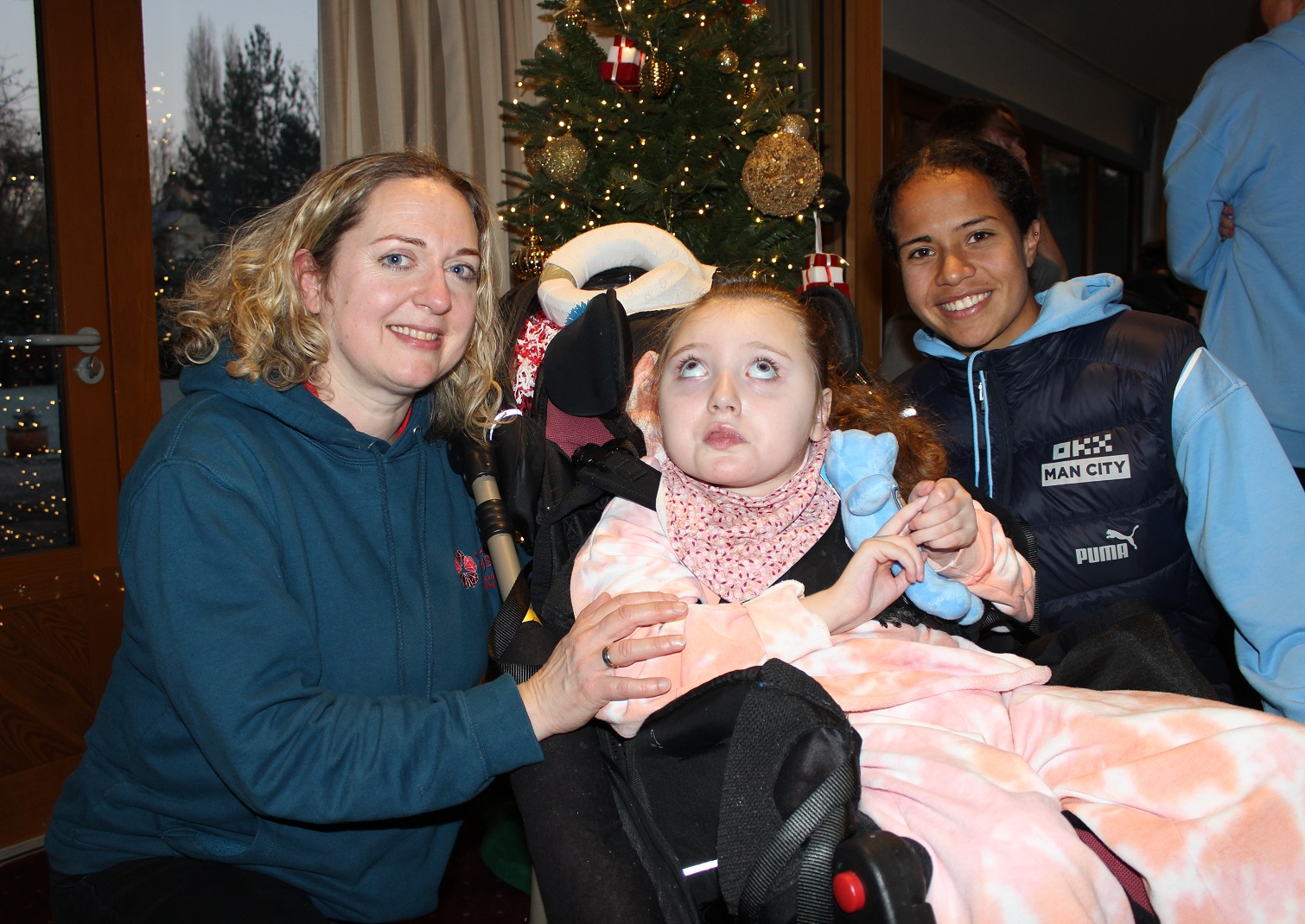 Mother and daughter with Manchester City player at Francis House