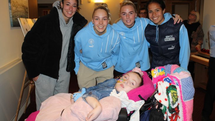 Manchester City players with child at Francis House