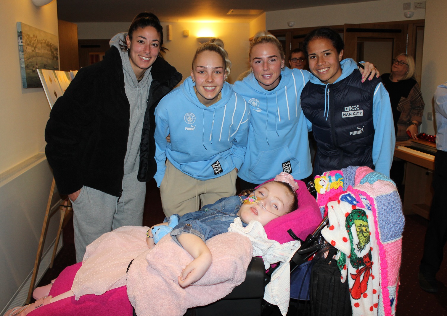 Manchester City players with child at Francis House