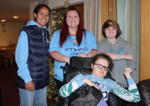 Manchester city player with a family at Francis House