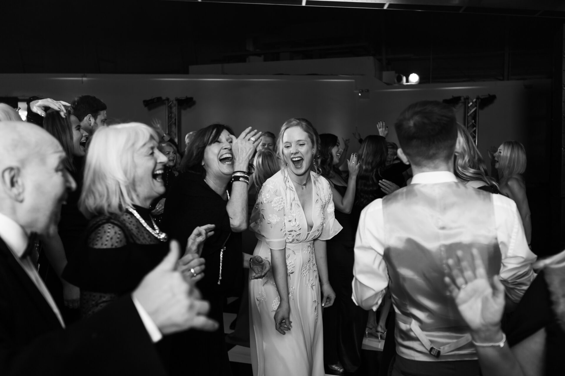 Women laughing at an evening reception event