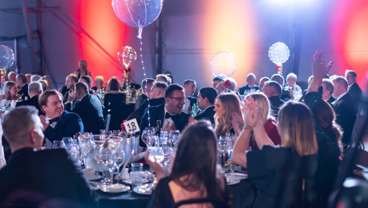 People sat around a table at an evening gala reception