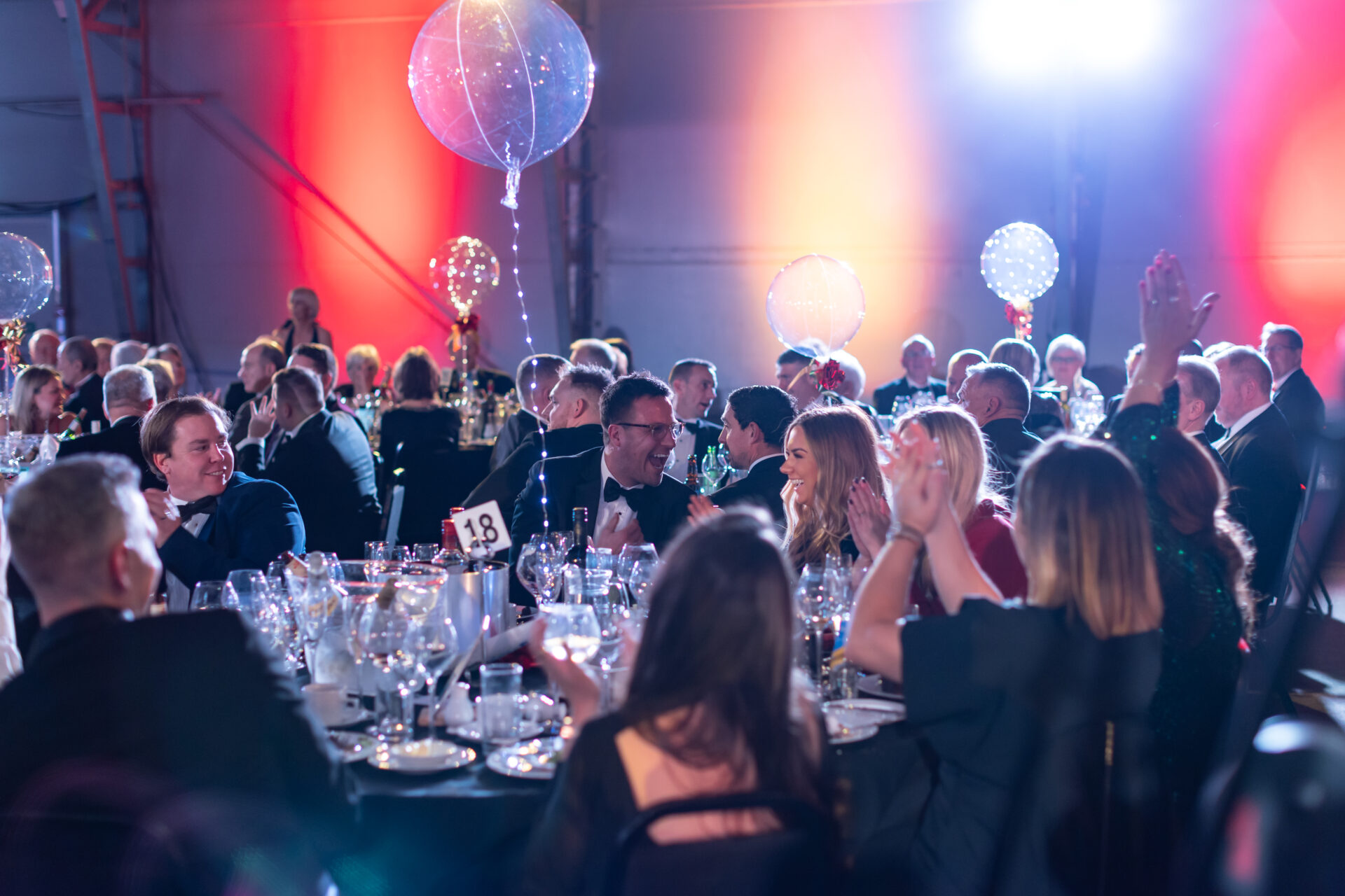 People sat around a table at an evening gala reception