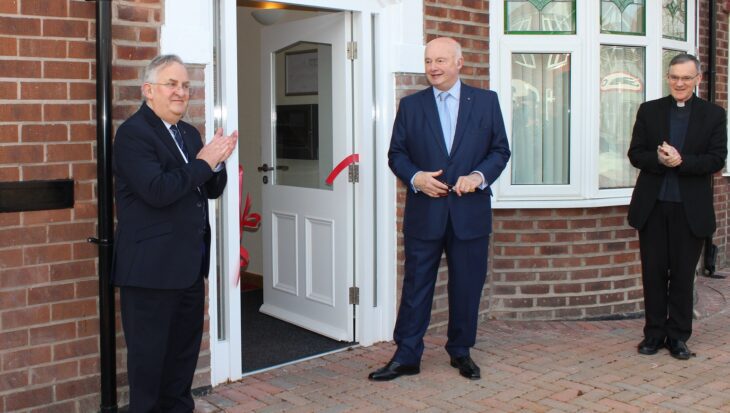 David Ireland Sir Warren Smith and Bishop Arnold stood at the front door of the care home