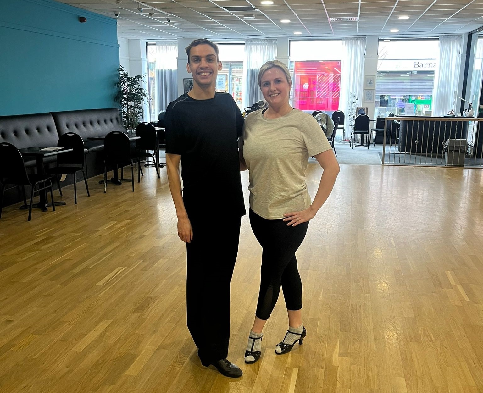Two people stood in a dance studio