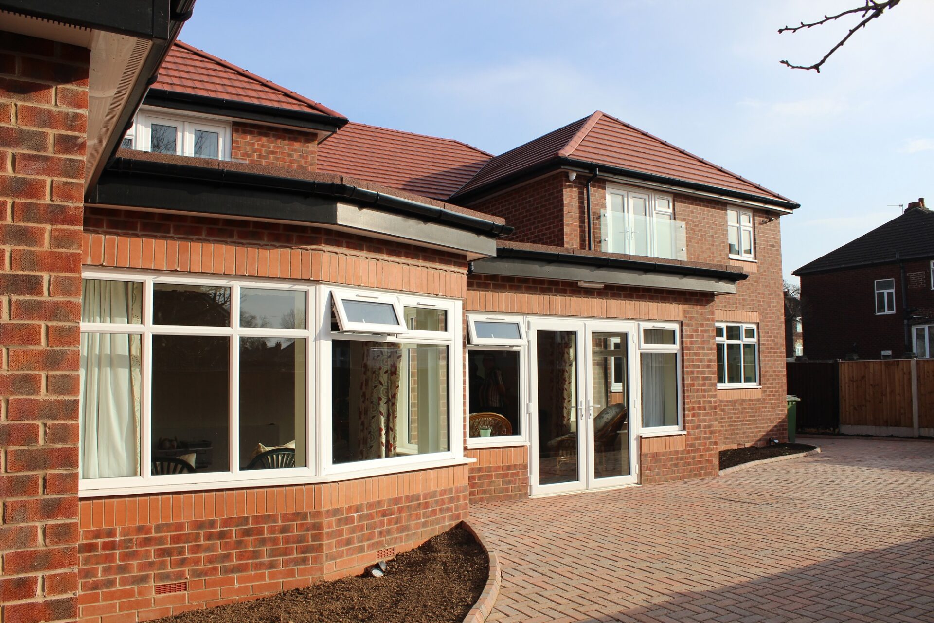 View of back of house with paved garden area