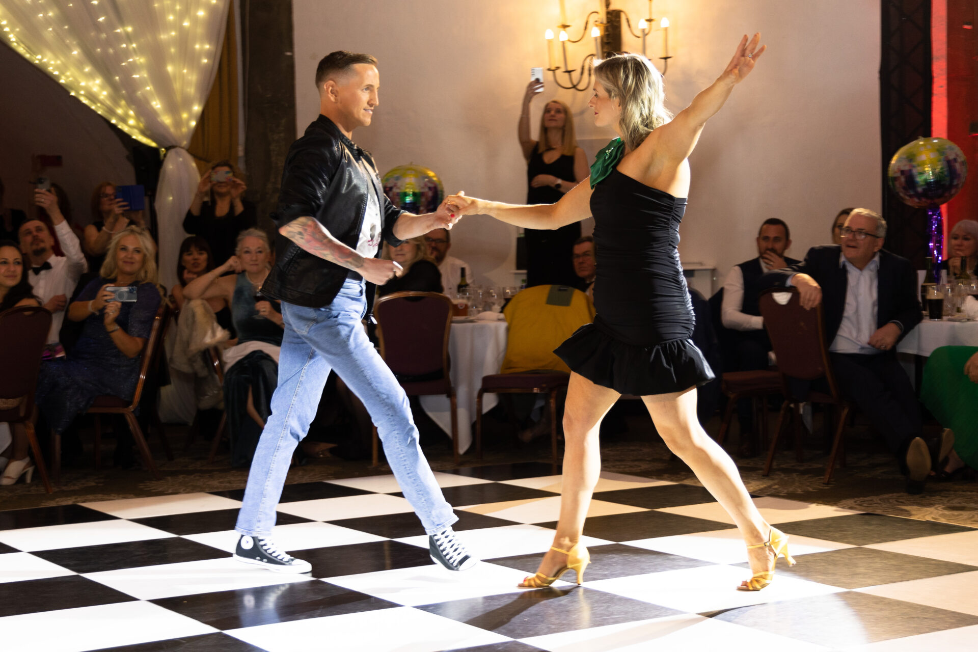 Two dancers dancing on a dance floor