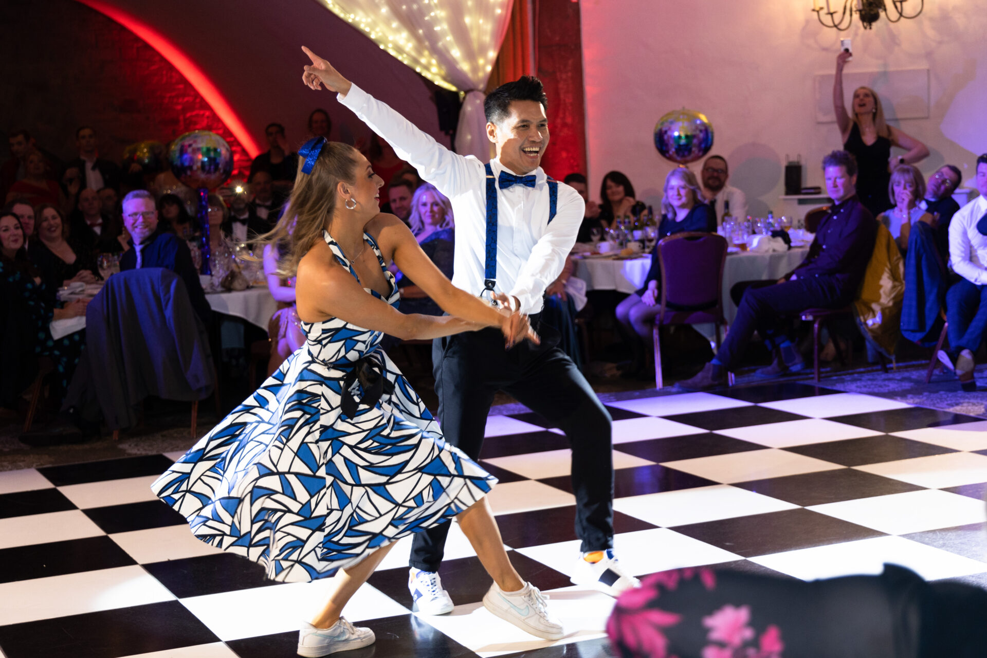 Two people dancing on a dance floor