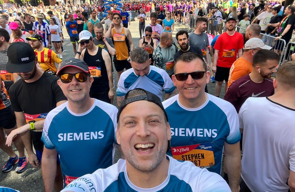 Group of runners at the start of the Great Manchester Run race