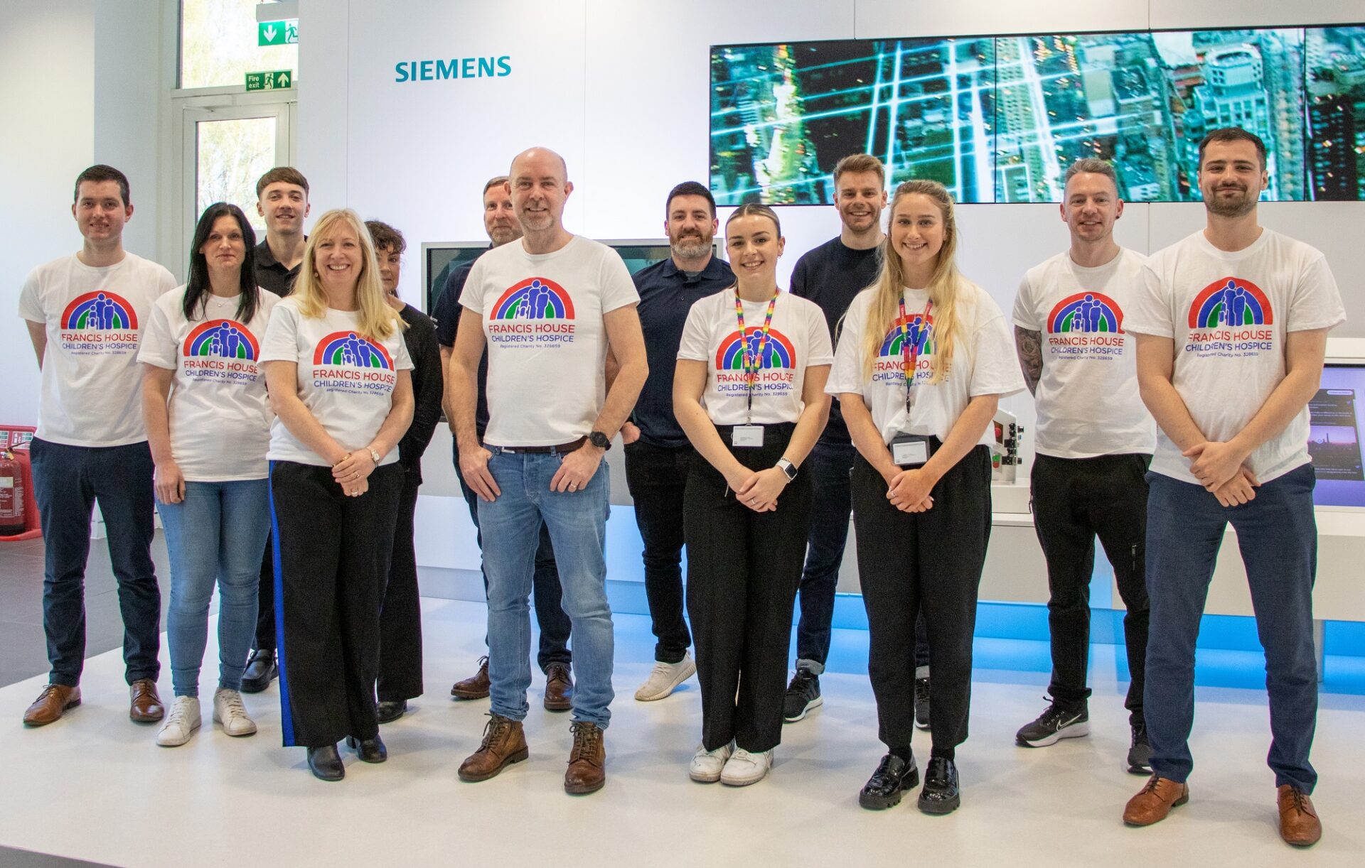 Group of people stood in office setting