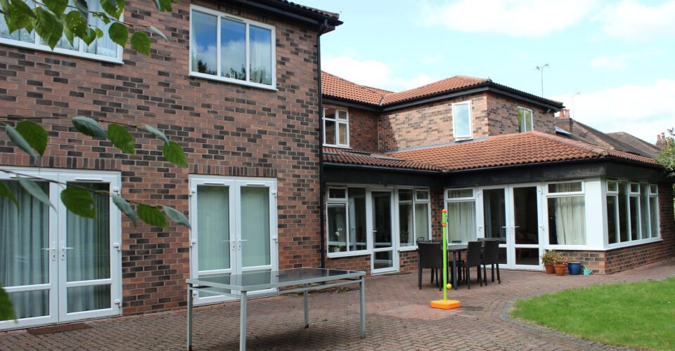 Back of a house with garden and patio area