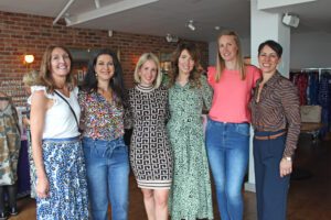 Six women stood in a restaurant