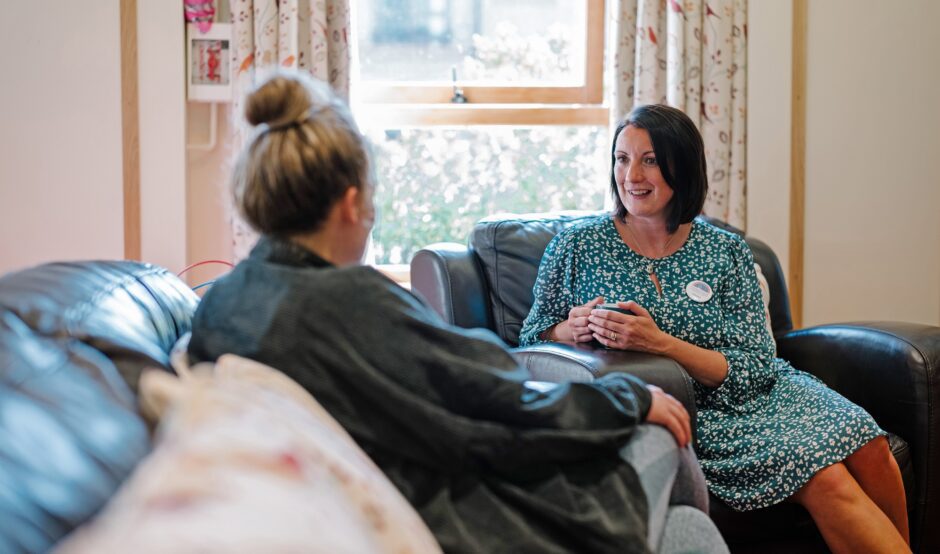 Care team Cerysa listening to feedback from hospice mum