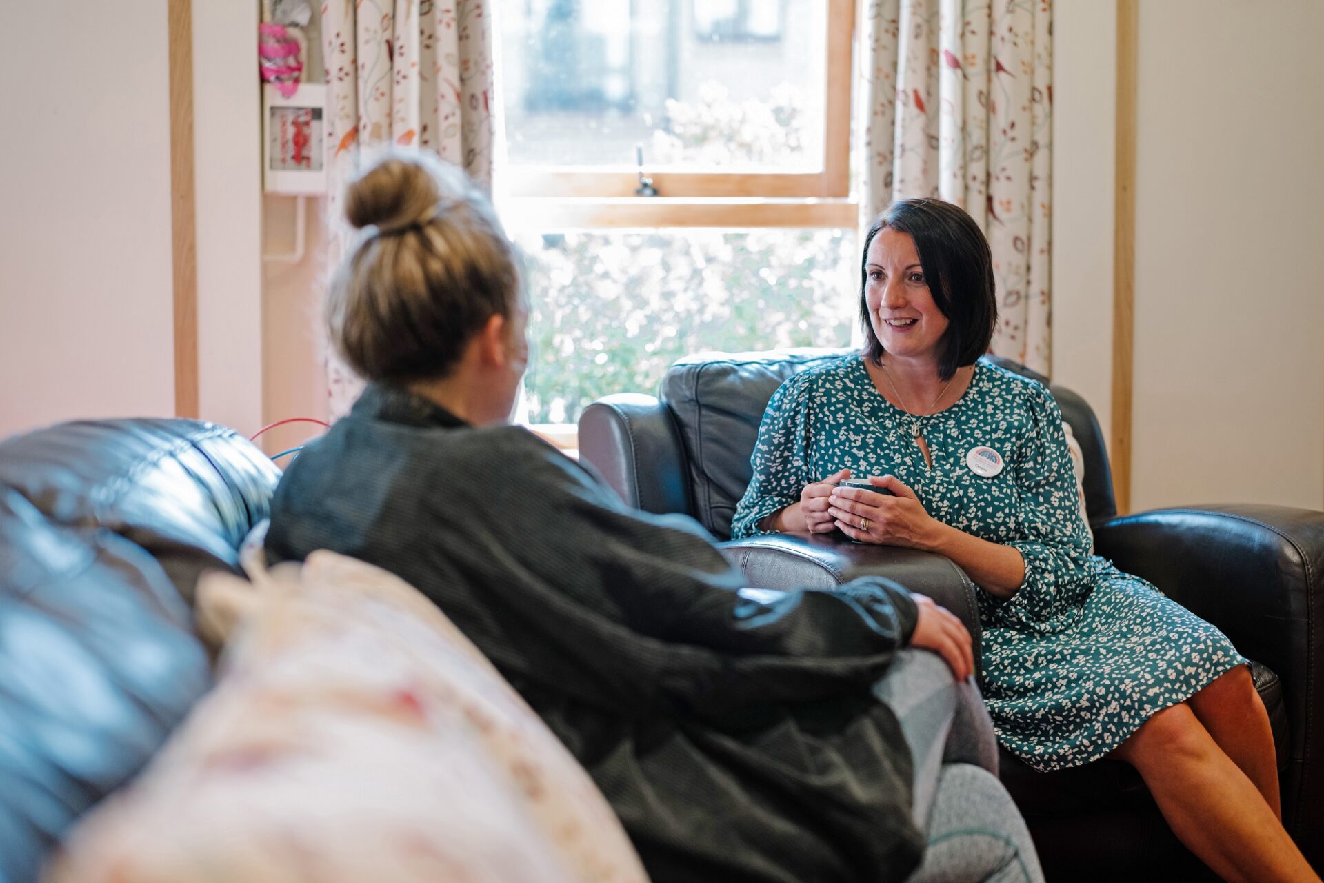 Care team Cerysa listening to feedback from hospice mum